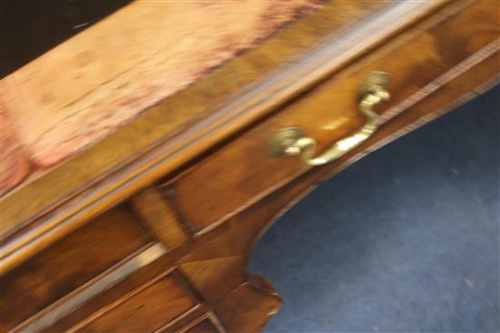 A Georgian style writing table, fitted five frieze drawers and inset leather skiver, W.150cm